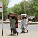 People flee with their belongings in Maiduguri a year ago.